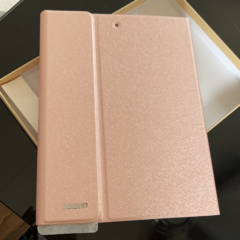 Rose gold iPad keyboard case and pen.